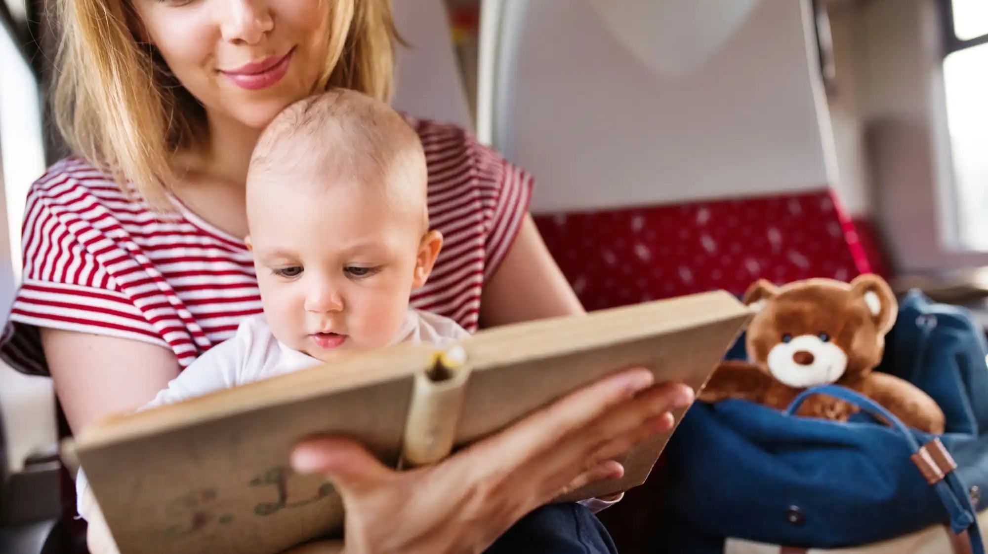 Picture of a mother and her baby in an airplane