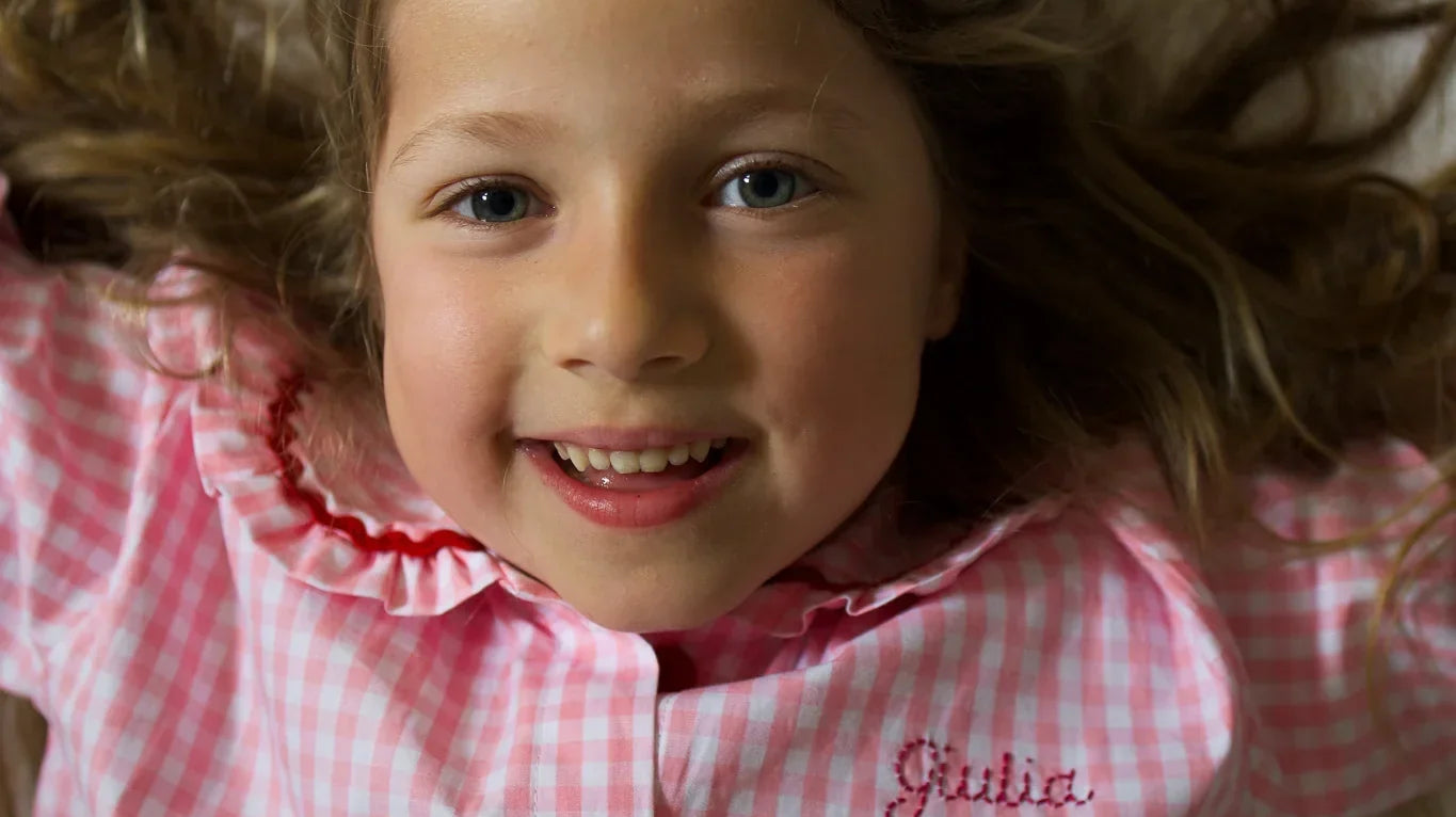 Picture of a child wearing a Cajou Paris' organic cotton pajama